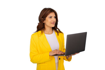 Young businesswoman in a stylish yellow jacket working on a laptop, looking away with a confident smile against a transparent background