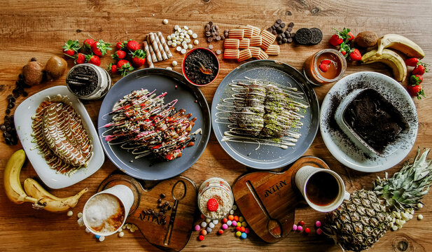 Delicious meat kebab with fresh vegetable salad served with variety of Turkish dishes and appetizers. Top view of assorted Turkish food and meze, tasty and healthy Mediterranean cuisine. Top view.