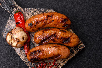 Grilled chicken or beef sausages with sauce and spices. Grilled sausages