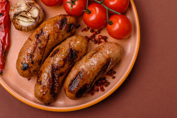 Grilled chicken or beef sausages with sauce and spices. Grilled sausages