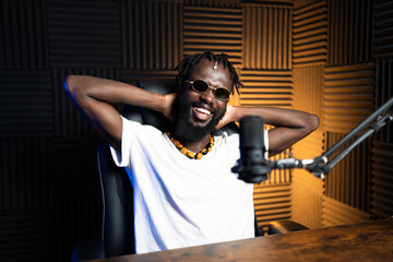 Content creator relaxing during podcast recording