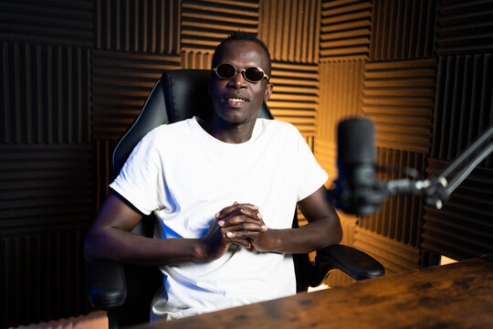 Content creator recording a podcast in a professional studio