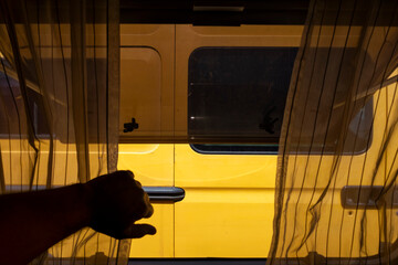 Yellow van through camper curtains