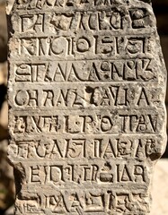 Ancient stone inscription with carved text