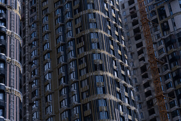 Construction site showcasing tall buildings with unique architectural features
