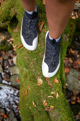 Woman legs with barefoot hiking shoes in the  mountain