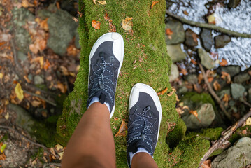 Woman legs with barefoot hiking shoes in the  mountain