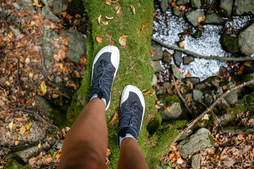 Woman legs with barefoot hiking shoes in the  mountain