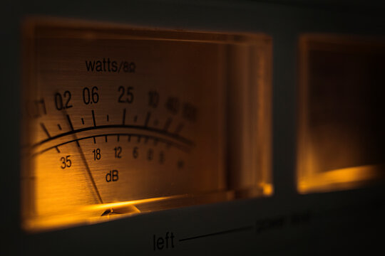 Analog Watt Meter Displays Power Output and Db Levels in Dark Setting