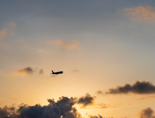 Airplane that just took of to the beautiful sunset sky. Transportation