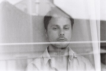Male portrait in a window