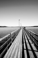 Wooden pier in the lake in black and white
