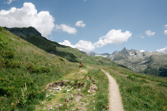 young woman hiking the Tour des Fiz in the french Alp