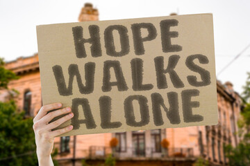 “Hope  Walks  Alone”. Dreams moving through crowds unseen and unsupported.  
HOPE. WALK. ALONE....