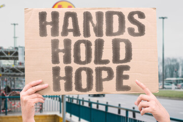 “Hands  Hold Hope”  Grasping on without letting go—strength in fragile moments.  
HANDS. HOPE. STRENGTH. SUPPORT. FRAGILITY.