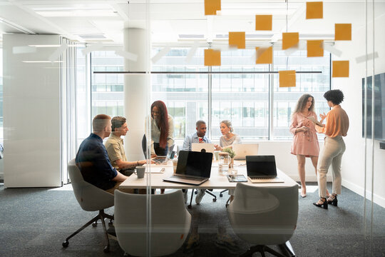 Business team collaborating on project in modern office meeting room