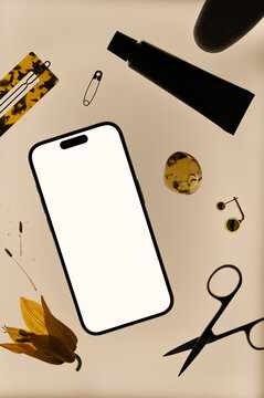 Flat lay of smartphone mockup and personal care items 