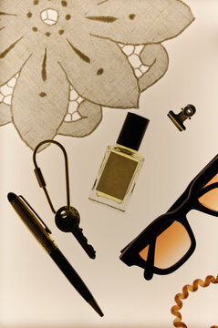 Flat lay of perfume bottle mockup with everyday personal items