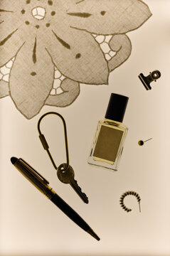 Flat lay of perfume bottle mockup with everyday personal items
