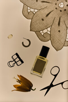 Flat lay of perfume bottle mockup with everyday personal items