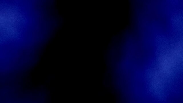 Royal blue smoke flow on black background 4K. Grainy noise, grunge texture. Smooth animation. Bright blue mist cloud effect as frame on dark backdrop for presentation, intro, digital cover, web design