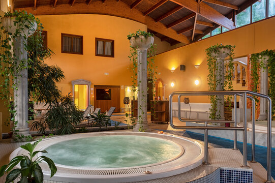 Indoor spa with circular hot tubs