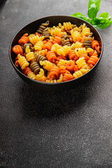 pasta trottole tricolor pasta spiral dish twisted Italian food tasty snack fresh delicious gourmet food background on the table rustic top view copy space  vegan and vegan food