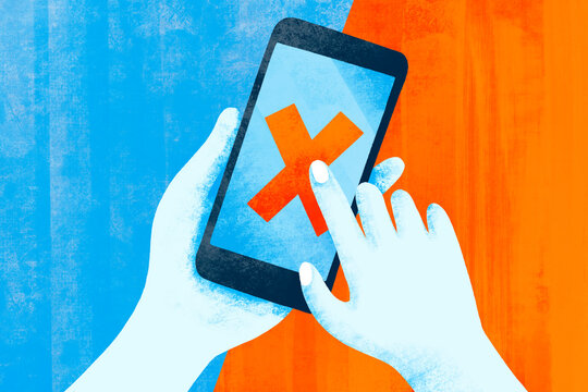 Person interacting with smartphone displaying a red cross symbol
