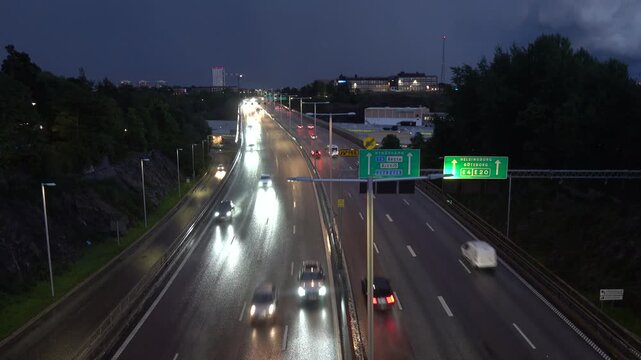Stockholm, Sweden Traffic on a stormy wet night on the E4 highway or Essingeleden.