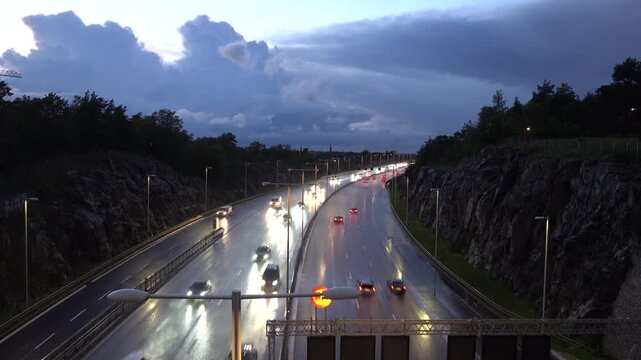 Stockholm, Sweden Traffic on a stormy wet night on the E4 highway or Essingeleden.