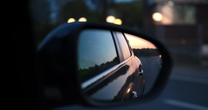 Blind spot monitoring icon on the mirror of a modern car. High quality 4k footage