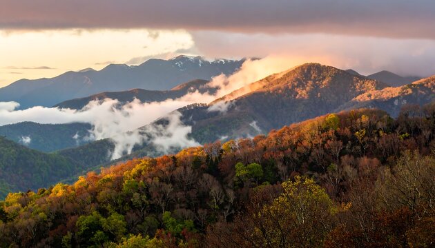 Mountain range at sunset, autumn colors, mist, and clouds
