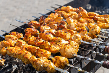 Juicy sizzling shish kebab grilling on a charcoal grill