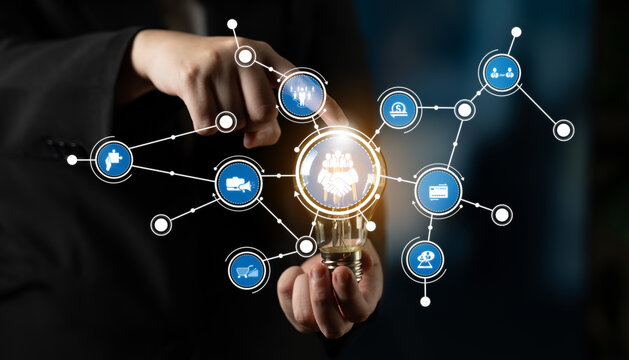 A business professional engages with a virtual interface showcasing various technology and data icons, representing innovation and connectivity in modern enterprises. Crux