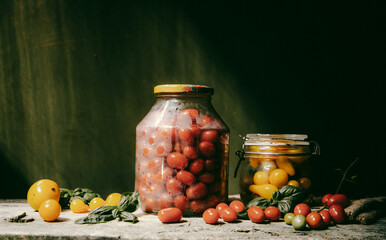 red and yellow cherry tomatoes in a jar for winter