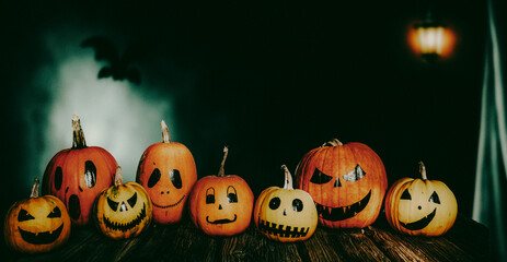 scary funny Halloween pumpkins on wooden table