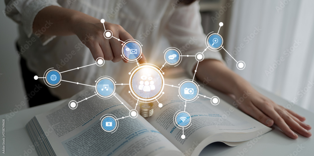 Poster a person interacts with a light bulb symbolizing ideas and digital connectivity over an open book, i