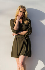 Summer Radiance: Blonde Beauty Glows Outside Her Home at Golden Evening Hour