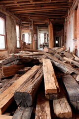A spacious, abandoned building features a floor scattered with old wooden beams and debris. Sunlight streams through broken windows, highlighting the decay and neglect of the space