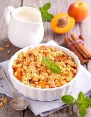 Apricot crumble dessert in a white dish