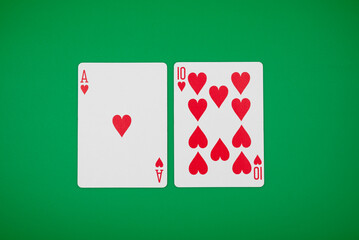Blackjack hand on green background, symbolizing casino games, gambling, and poker tournaments.