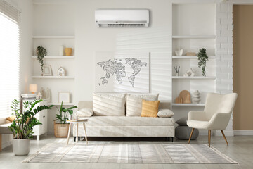 Air conditioner, contemporary furniture, houseplants and decor in living room
