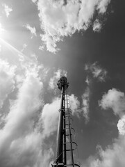 metal tower under stormy sky