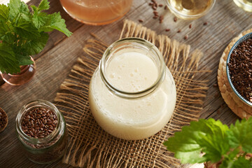 DIY shampoo made of homemade flax seed gel, argan oil, apple cider vinegar, nettle and coco glucoside