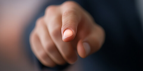 Pointing finger towards viewer. Hand reaching out, emphasizing direction and engaging the viewer. Foreshortened perspective creates a sense of immediacy.