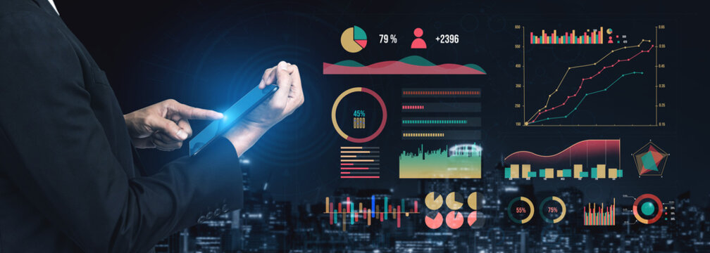 A business professional interacts with digital graphs and analytics on a tablet, set against a modern cityscape backdrop, showcasing data-driven decision-making. Impute