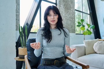 Web cam view of young woman talking looking in camera, online meeting, video call