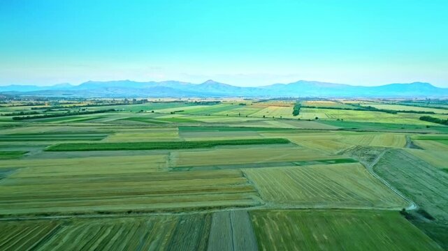 Beautiful countryside nature, valley, cultivated fields, mountains, clear sky
