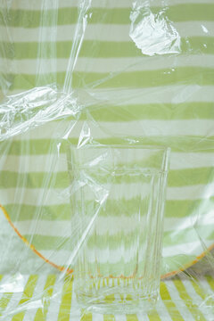 Clear glass in front of striped green and white background