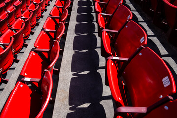 Stadium Seating Captured in Bright Red Colors During Midday